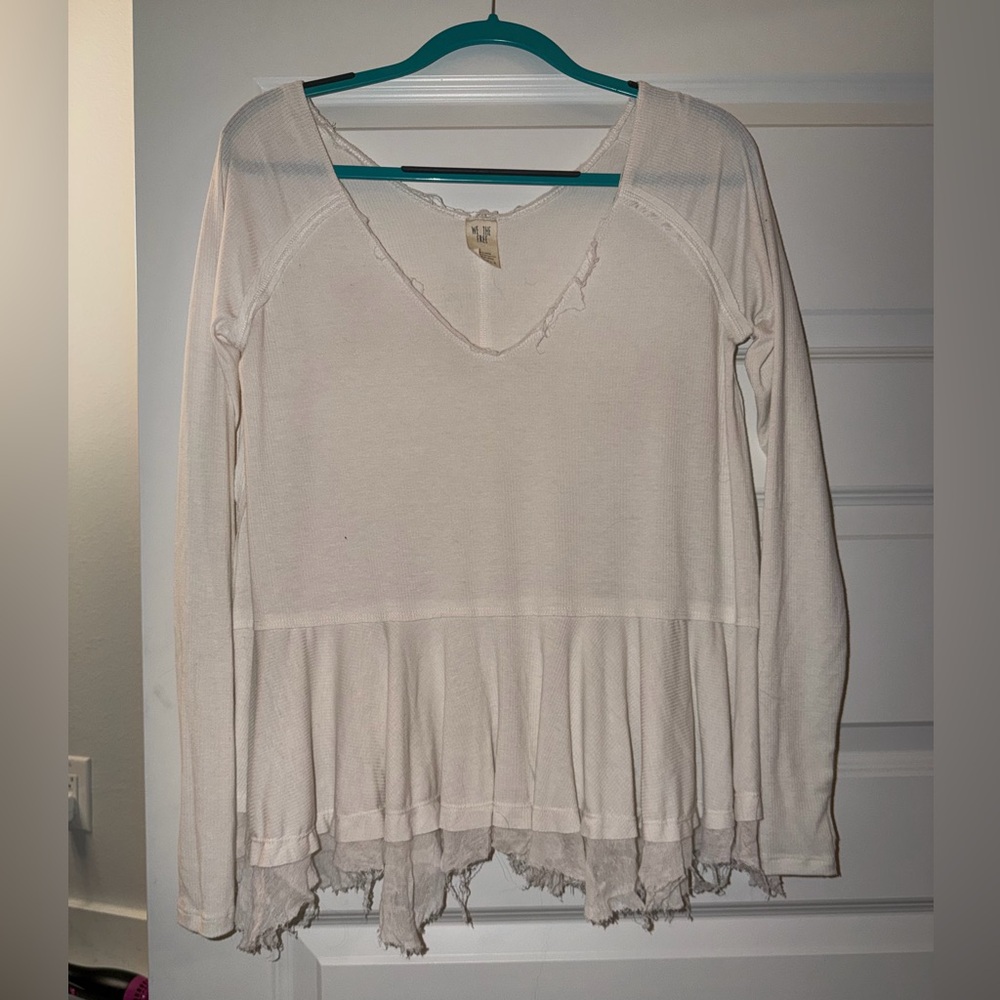 We the free flowy distressed top